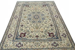 Surface texture of 2000s Nain rug with natural Wool and intricate pattern
