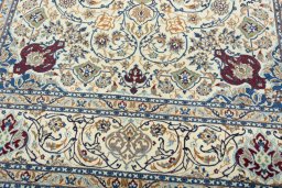 Close-up detail of 2000s Nain rug from Iran / Persia showing Wool weave