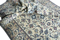 Surface texture of 2000s Nain rug with natural Wool and intricate pattern
