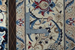Backside of handmade 2000s Nain rug showing knot structure and weave density
