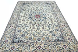Surface texture of 2000s Nain rug with natural Wool and intricate pattern
