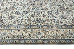 Corner detail of 2000s Nain rug showing border pattern and Wool pile