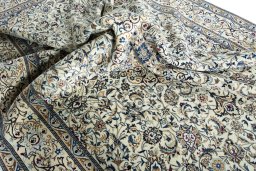 Surface texture of 2000s Nain rug with natural Wool and intricate pattern