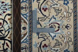 Backside of handmade 2000s Nain rug showing knot structure and weave density