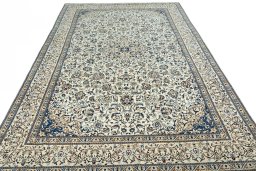 Surface texture of 2000s Nain rug with natural Wool and intricate pattern