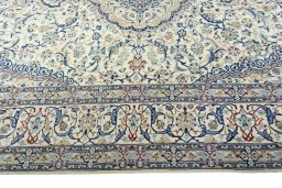 Corner detail of 2000s Nain rug showing border pattern and Wool pile