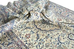 Surface texture of 2000s Nain rug with natural Wool and intricate pattern