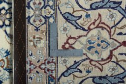 Backside of handmade 2000s Nain rug showing knot structure and weave density