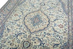 Backside of handmade 2000s Nain rug showing knot structure and weave density