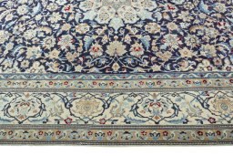 Corner detail of 1970s Nain rug showing border pattern and Wool pile