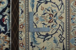 Backside of handmade 1970s Nain rug showing knot structure and weave density