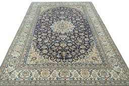 Surface texture of 1970s Nain rug with natural Wool and intricate pattern