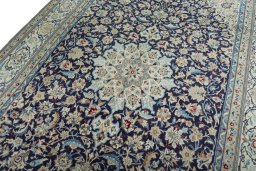 Backside of handmade 1970s Nain rug showing knot structure and weave density
