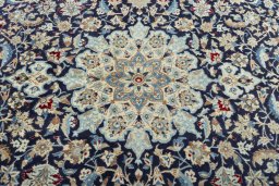 Central medallion detail of 1970s Nain rug from Iran / Persia