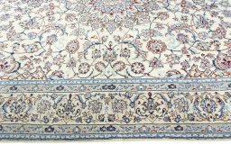 Corner detail of 2000s Nain rug showing border pattern and Wool pile