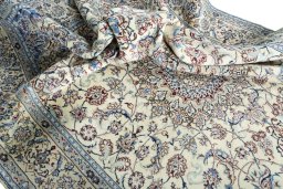Surface texture of 2000s Nain rug with natural Wool and intricate pattern