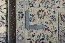 Backside of handmade 2000s Nain rug showing knot structure and weave density
