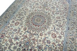 Backside of handmade 2000s Nain rug showing knot structure and weave density