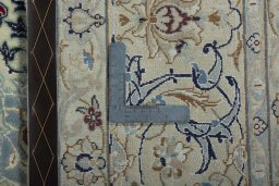 Backside of handmade 2000s Nain rug showing knot structure and weave density