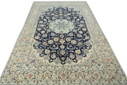 Surface texture of 2000s Nain rug with natural Wool and intricate pattern