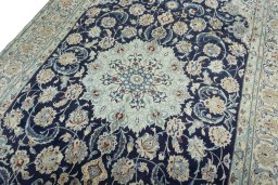 Backside of handmade 2000s Nain rug showing knot structure and weave density