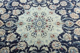 Central medallion detail of 2000s Nain rug from Iran / Persia