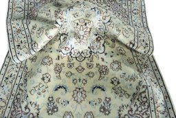 Surface texture of 2000s Nain rug with natural Wool and intricate pattern