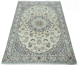 Surface texture of 2000s Nain rug with natural Wool and intricate pattern