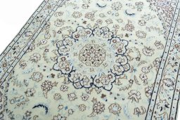 Backside of handmade 2000s Nain rug showing knot structure and weave density