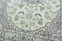 Close-up detail of 2000s Nain rug from Iran / Persia showing Wool weave