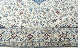 Corner detail of 2000s Nain rug showing border pattern and Wool pile