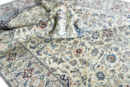 Surface texture of 2000s Nain rug with natural Wool and intricate pattern