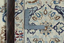 Backside of handmade 2000s Nain rug showing knot structure and weave density