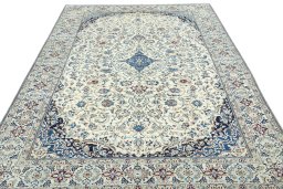 Surface texture of 2000s Nain rug with natural Wool and intricate pattern