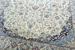Close-up detail of 2000s Nain rug from Iran / Persia showing Wool weave