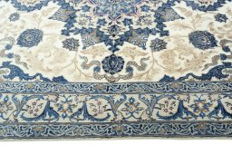 Corner detail of 2000s Nain rug showing border pattern and Wool pile