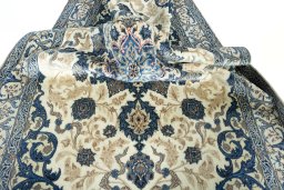 Surface texture of 2000s Nain rug with natural Wool and intricate pattern