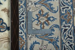 Backside of handmade 2000s Nain rug showing knot structure and weave density
