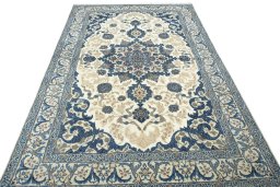 Surface texture of 2000s Nain rug with natural Wool and intricate pattern