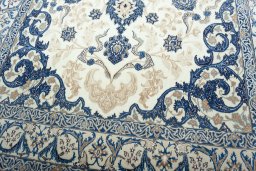 Close-up detail of 2000s Nain rug from Iran / Persia showing Wool weave