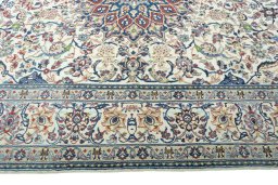 Corner detail of 2000s Nain rug showing border pattern and Wool pile