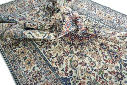 Surface texture of 2000s Nain rug with natural Wool and intricate pattern