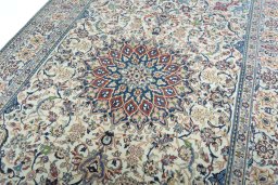 Backside of handmade 2000s Nain rug showing knot structure and weave density