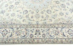 Corner detail of 2000s Nain rug showing border pattern and Wool pile