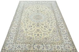 Surface texture of 2000s Nain rug with natural Wool and intricate pattern