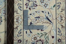 Backside of handmade 2000s Nain rug showing knot structure and weave density