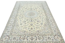 Surface texture of 2000s Nain rug with natural Wool and intricate pattern