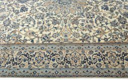 Corner detail of 2000s Nain rug showing border pattern and Wool pile