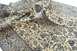 Surface texture of 2000s Nain rug with natural Wool and intricate pattern