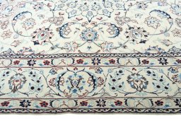Corner detail of 2000s Nain rug showing border pattern and Wool pile
